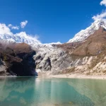 Birendra lake with mt. manaslu in background, gorkha, manaslu circuit trek nepal