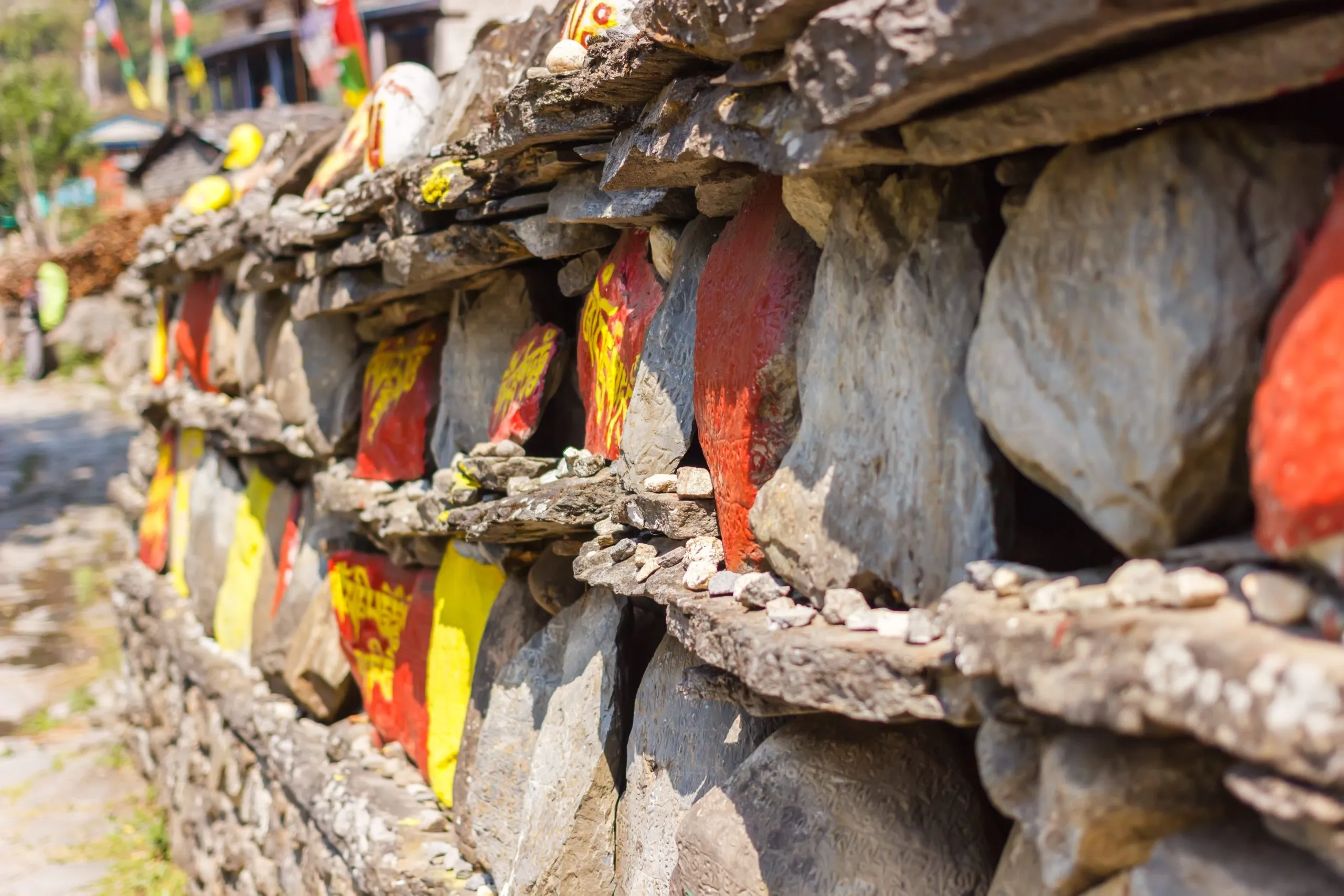 Mani wall decorated with mantras in the Himalayas