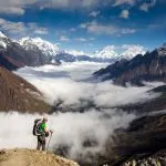 Trekker on the way to the valley covered with cloud on Manaslu circuit trek in Nepal