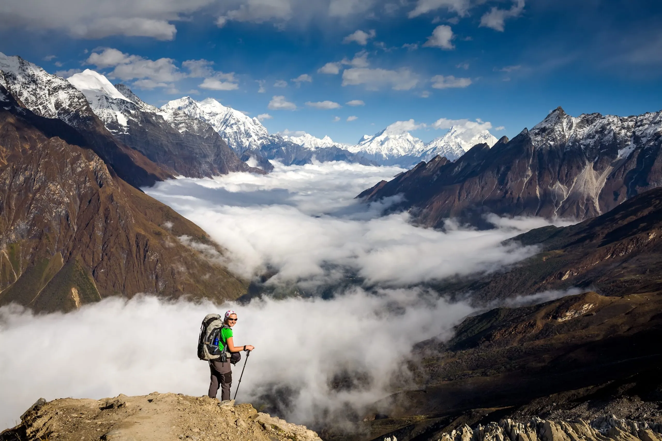 Trekker on the way to the valley covered with cloud on Manaslu circuit trek in Nepal